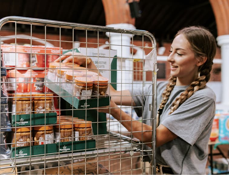 Bankuet team members delivering crates of essential food supplies for local food banks