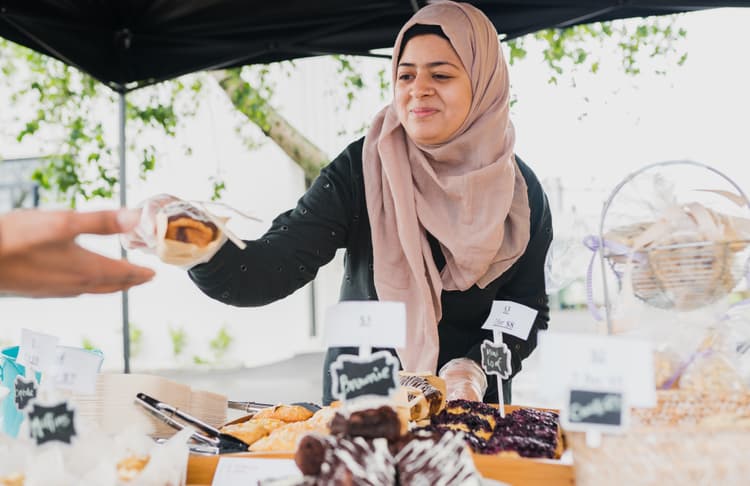 Community gathering with people sharing food and drinks