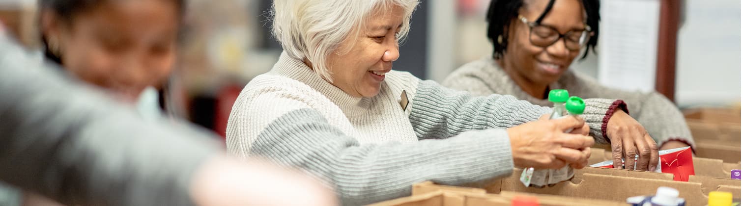 Bankuet food distribution warehouse with volunteers organizing supplies